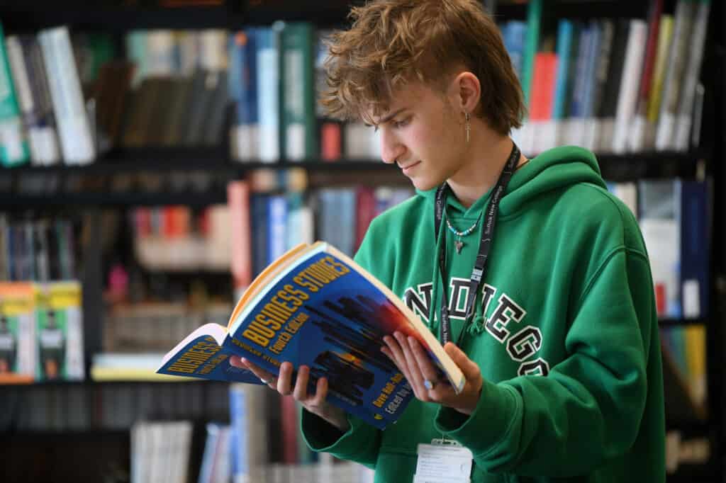 Learner reading business book in the learning curve