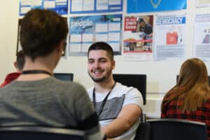 Learners talking in a business classroom