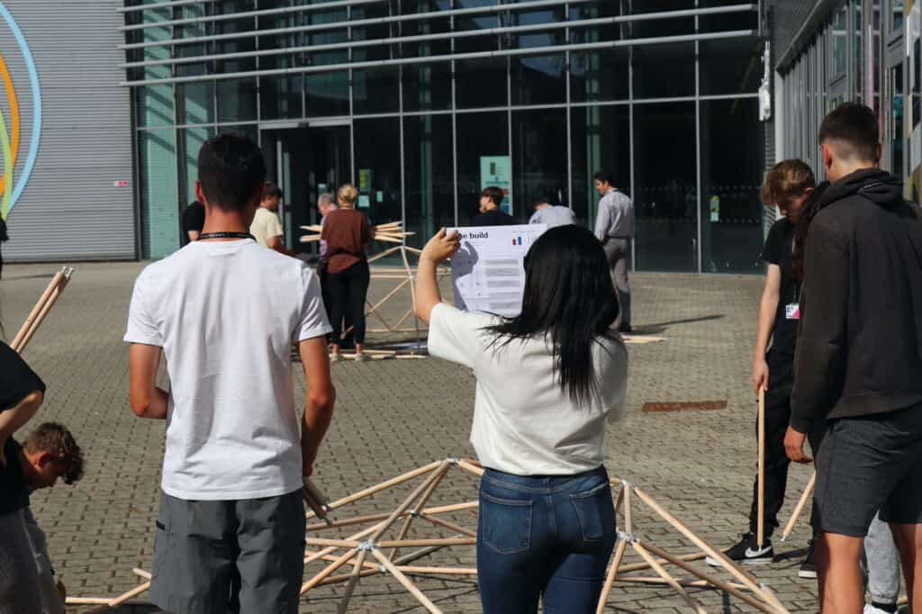 A group of T Level learners building a structure outside the Ipswich Campus