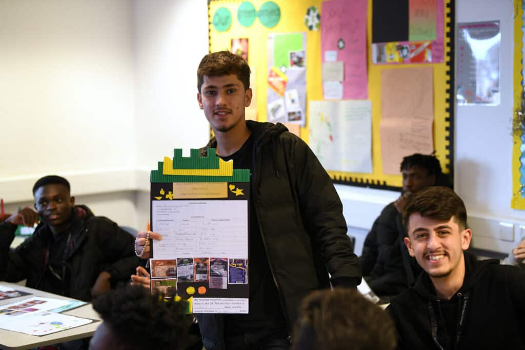 A learner presenting work in class.