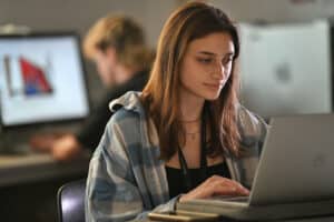 Female learner using a laptop.