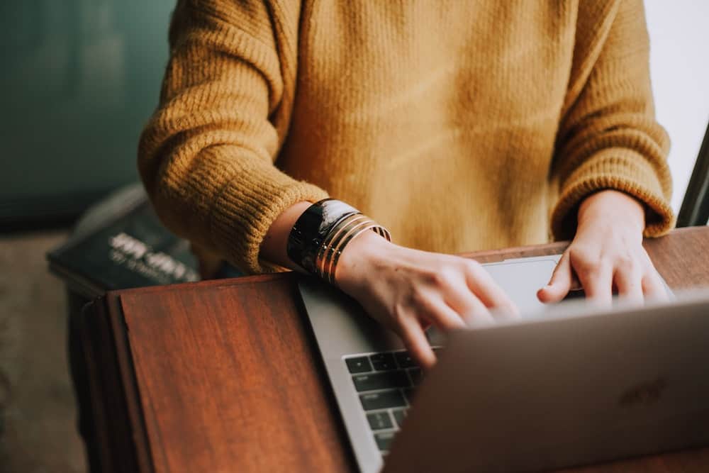 Adult using a laptop computer.