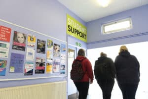 A group of learners next to the student support room