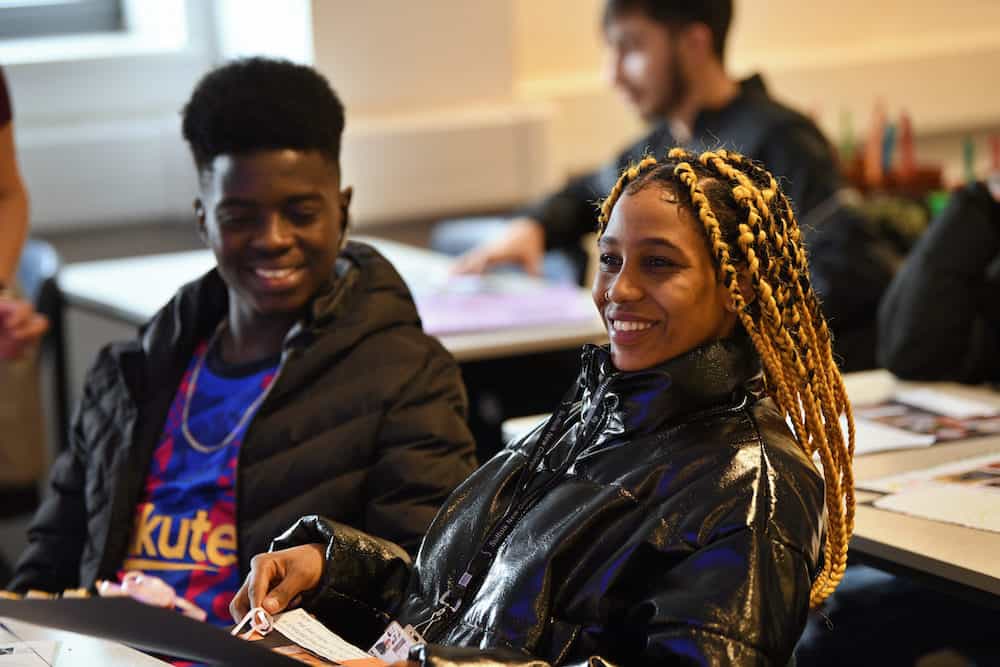 Two learners sitting in an ESOL classroom