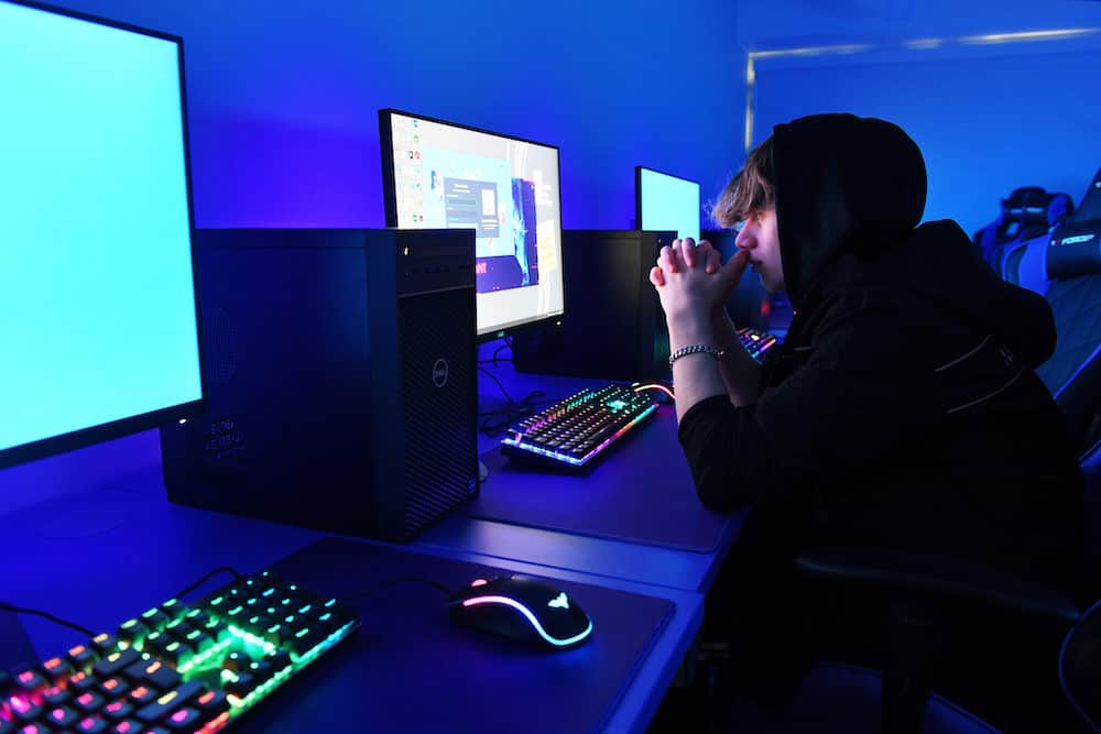 E Sport learner working on a computer in our tech campus