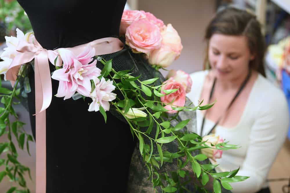 Floristry learner working on a wearable item