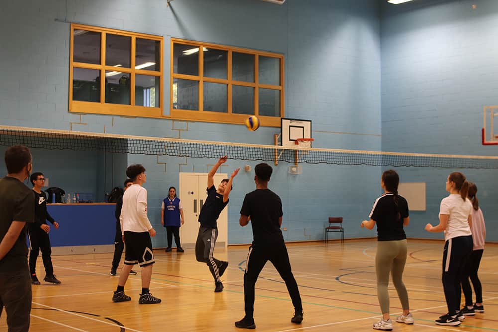 Learners playing vollyball