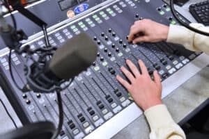 Learner using the radio station console