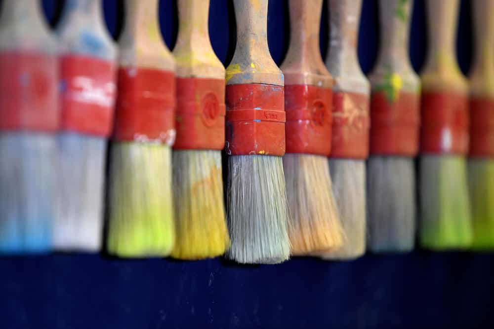Close up of painbrushes in the workshop