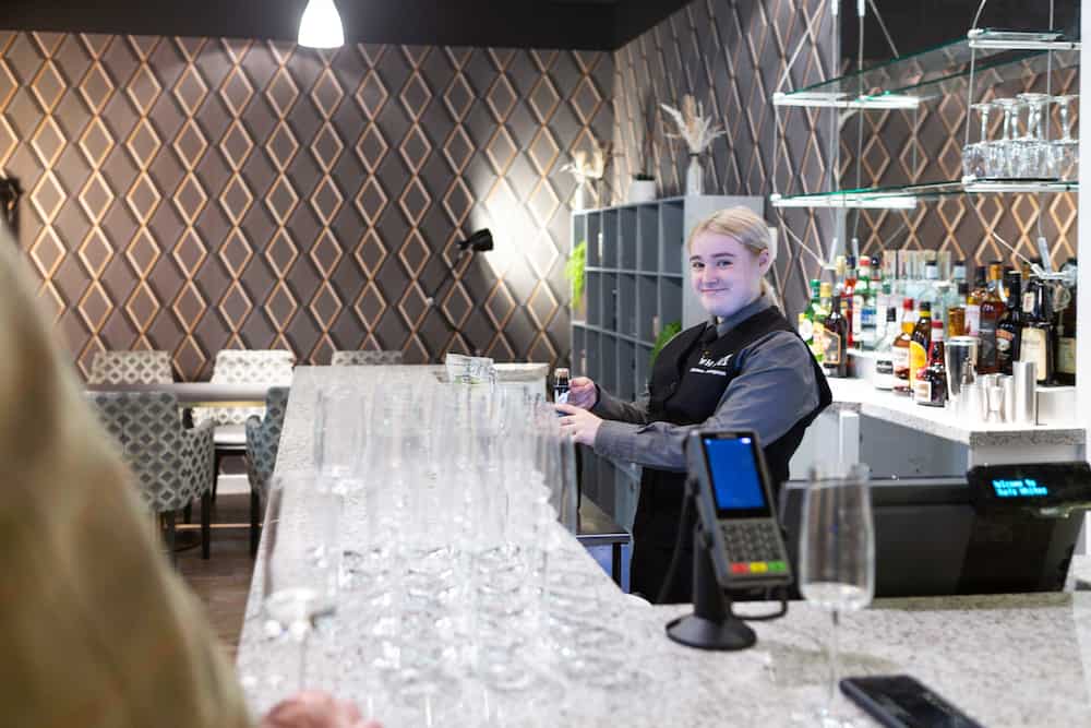 SCCA Learner Serving Drinks