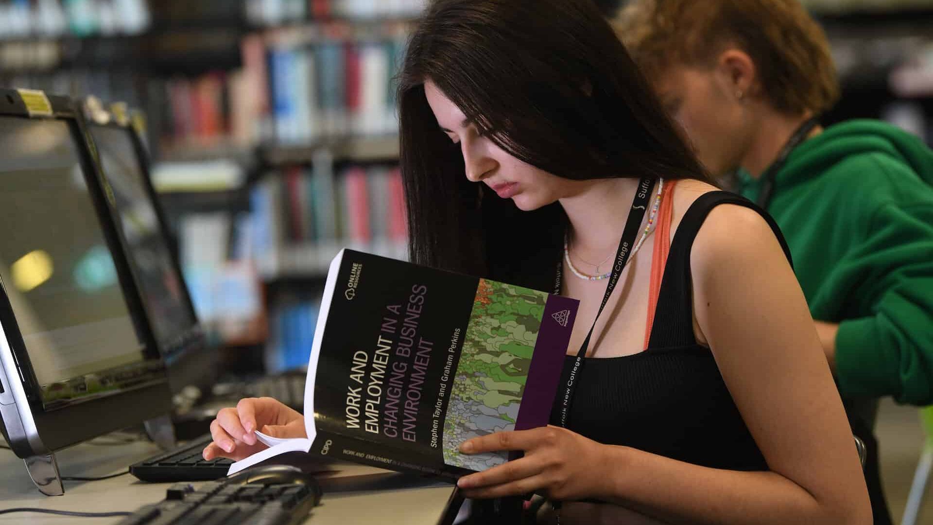 Learner reading a textbook in the learning curve