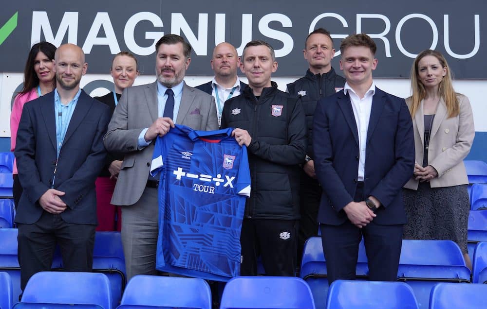 Suffolk New College and Ipswich Town Foundation members pose for a photo with an ITFC shirt