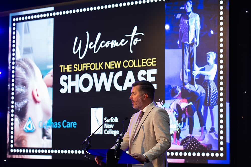 Suffolk New College Principal Alan Pease on Stage Delivering Opening Speech
