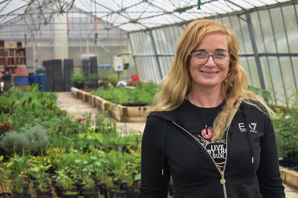 Maddy Holmes-Skelton in the greenhouses at Suffolk Rural Campus