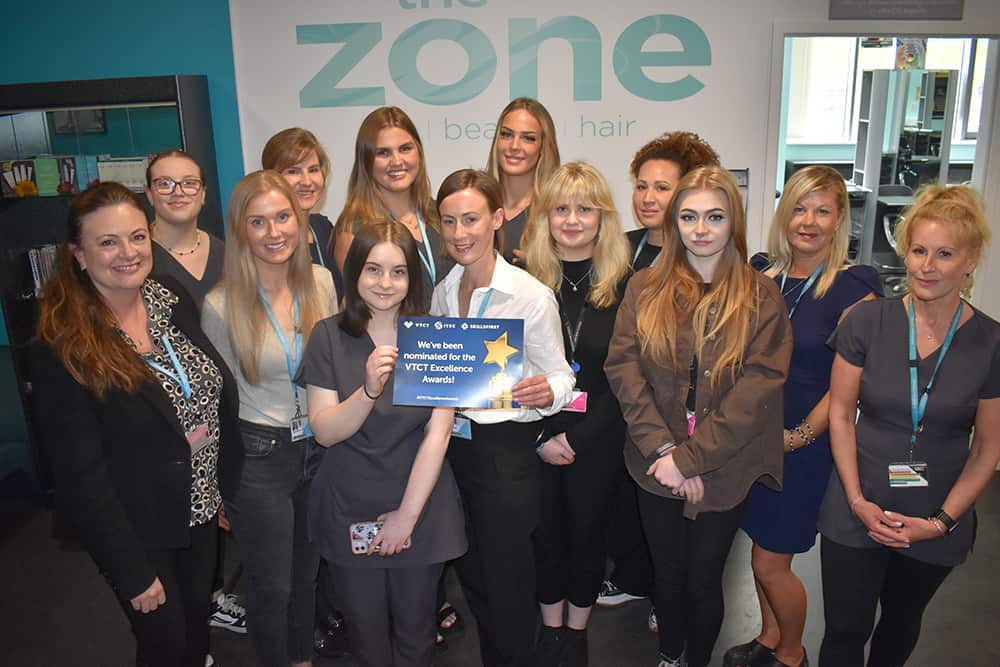 Learners and Tutors at Suffolk New College holding VTCT award certificate