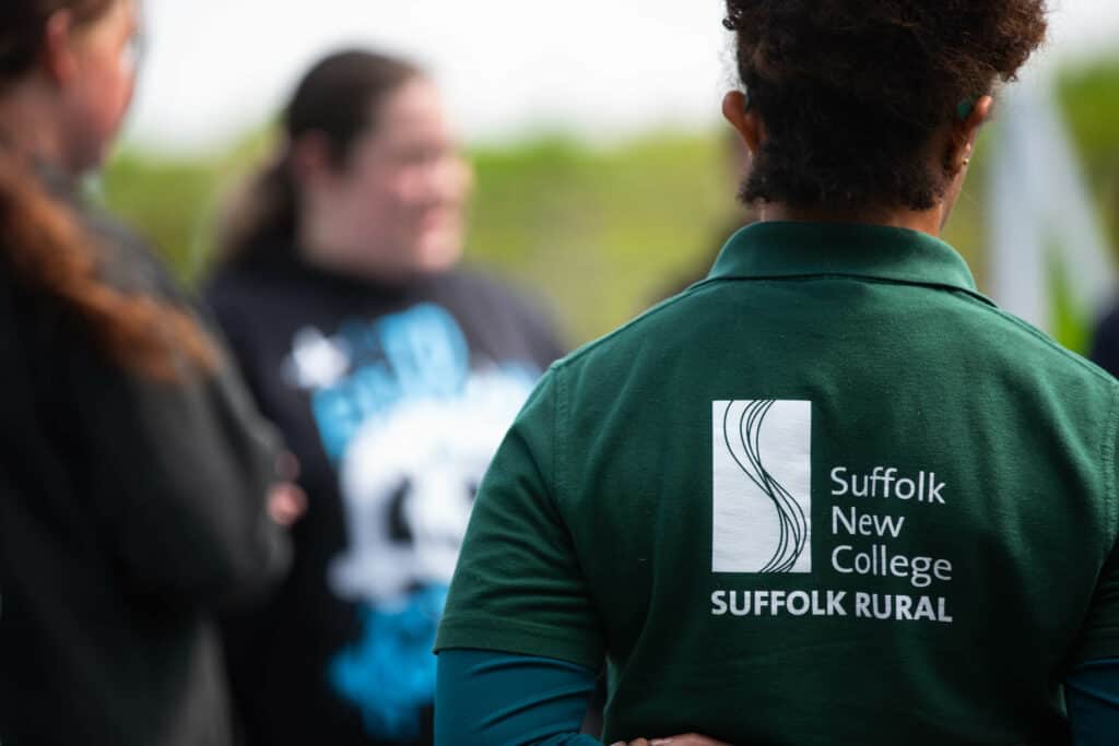 A learner wearing a Suffolk Rural polo shirt.