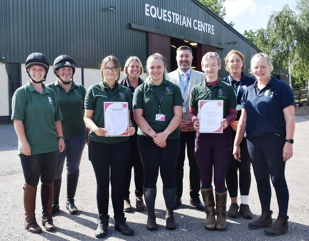 Students posing at the equine centre with Anne Hardwicke and Alan Pease