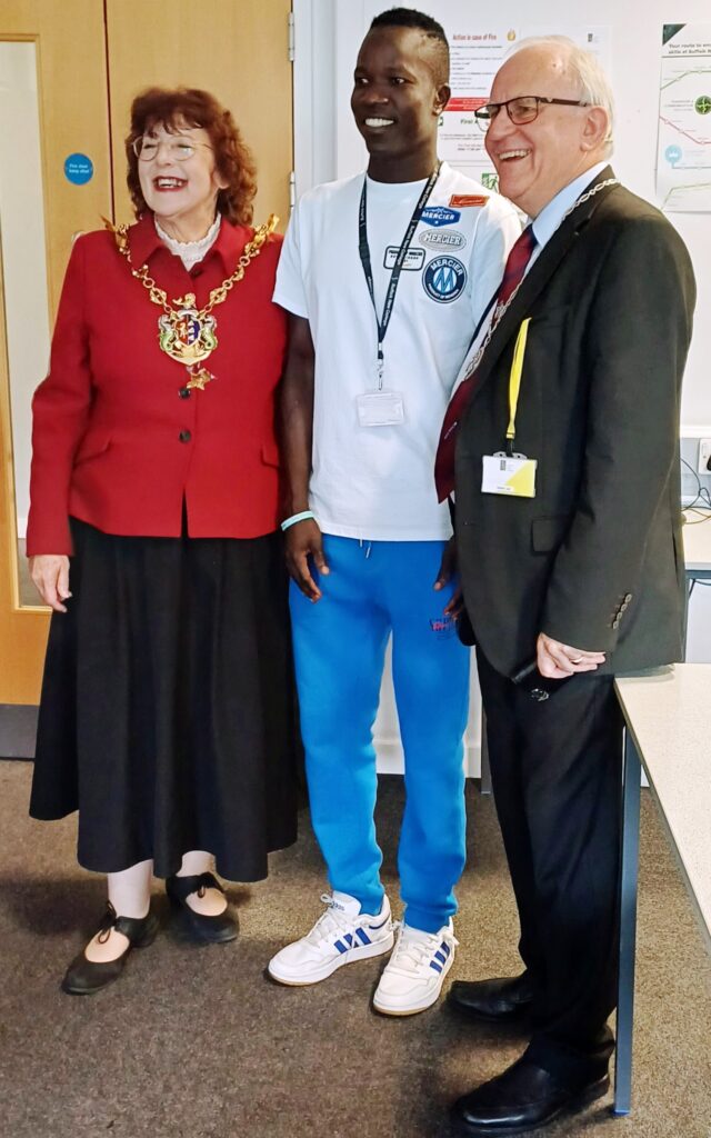 Mayor Lynne Mortimer and husband with SNC student Chan