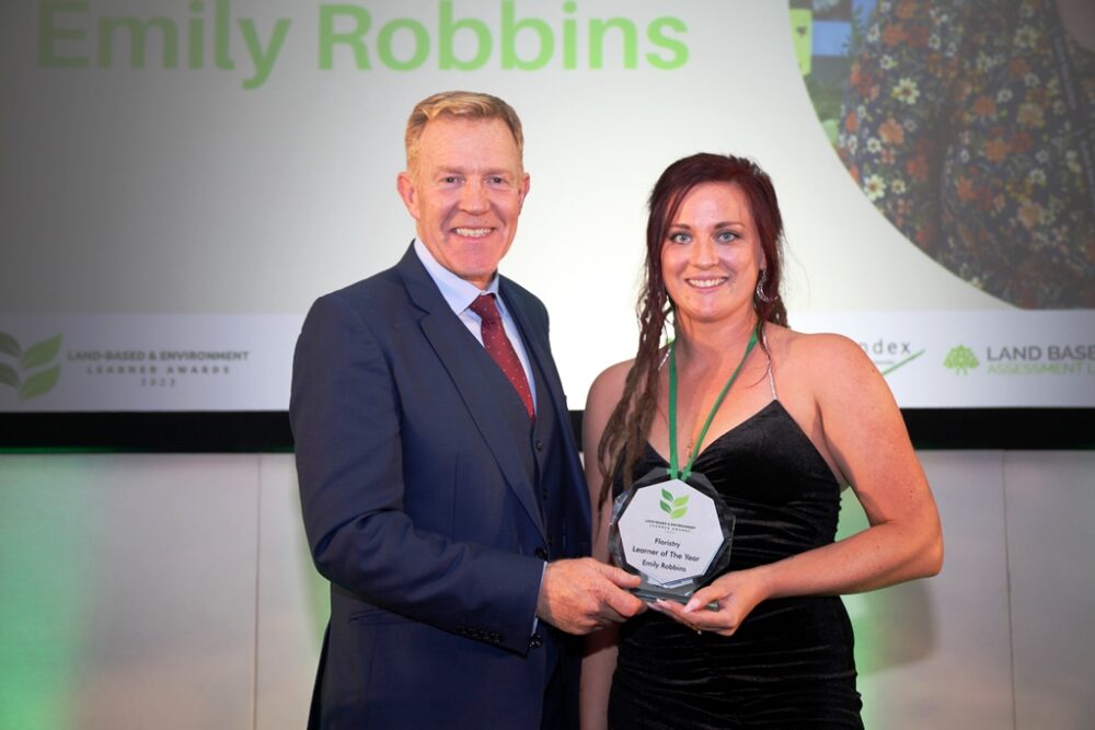 Alam henson with Emily Robbins winning her floristry award