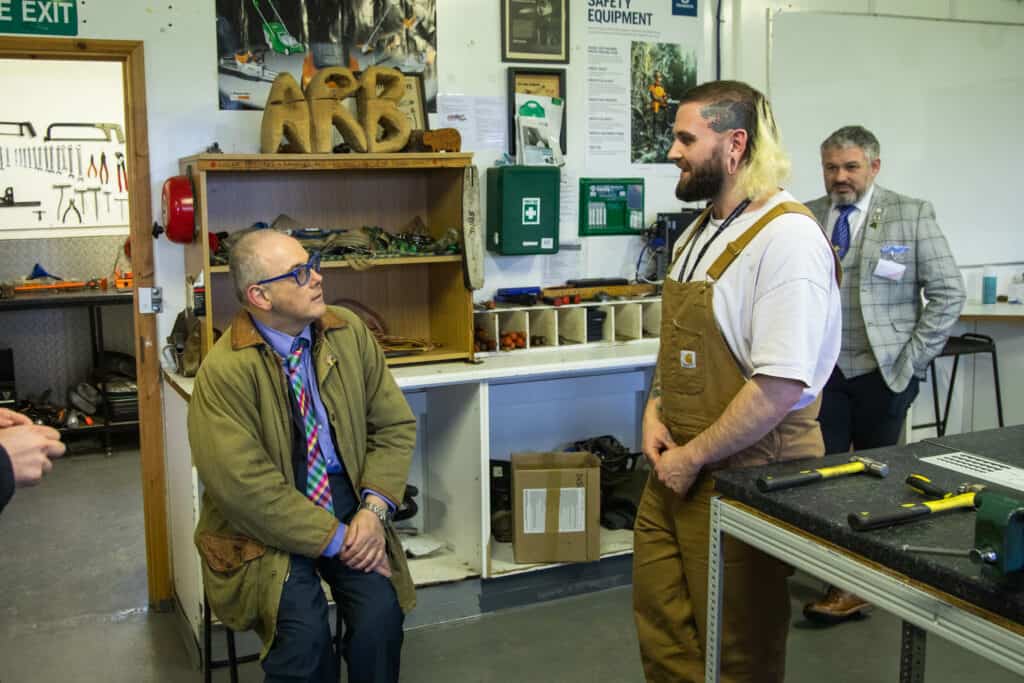 Skills minister with suffolk new college learners in aboriculture