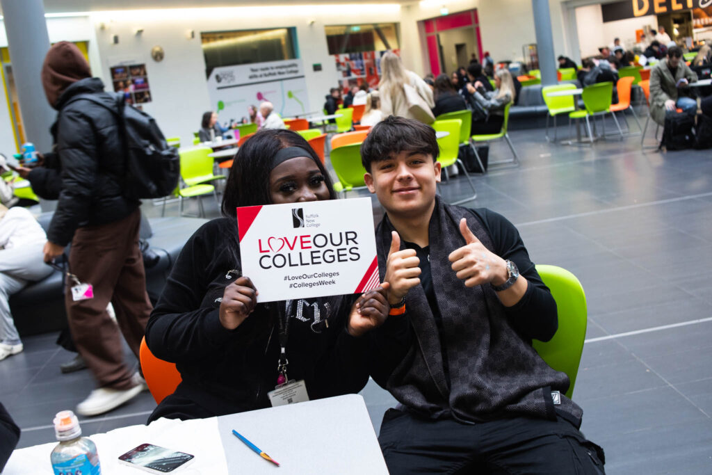 learners with AOC promotional sign for Colleges week