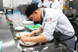 Trainee chef preparing food