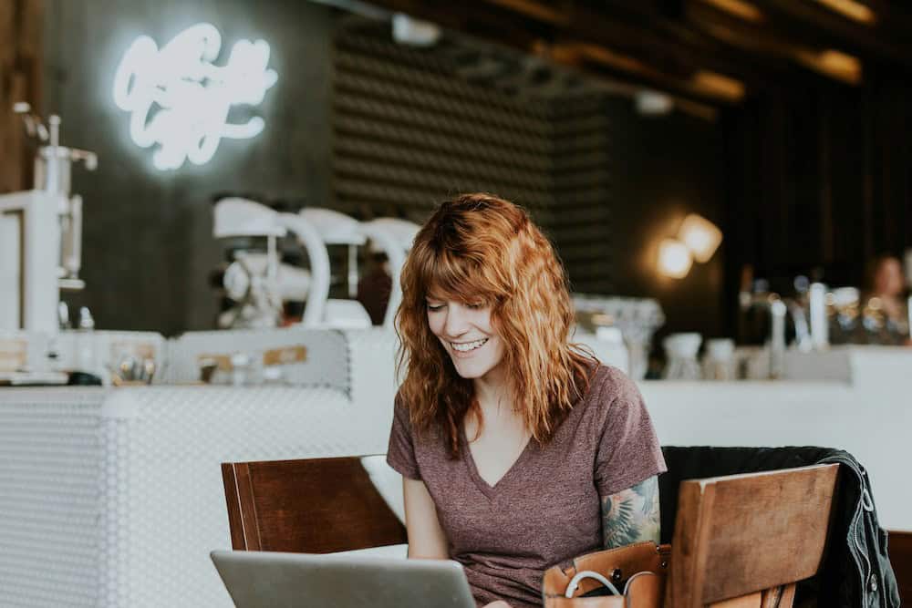 Adult learner in a cafe using a computer