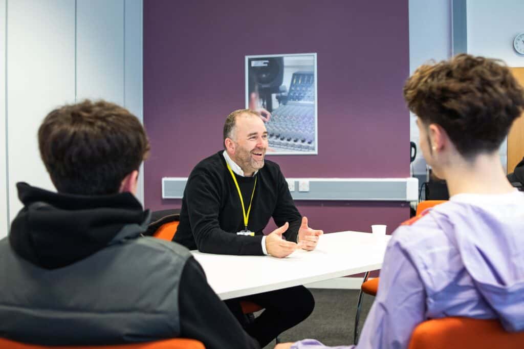 An employer talking to students at Suffolk New College