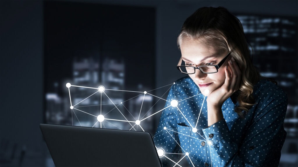 Adult Learner On A Laptop Analysing Data