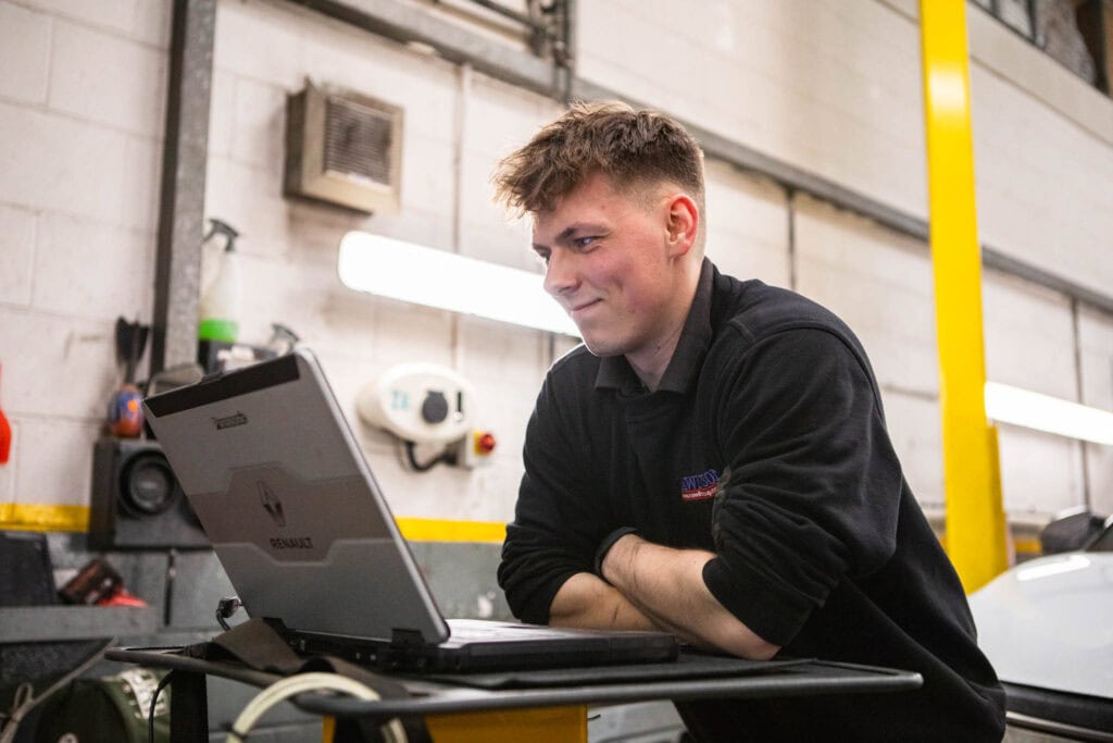 Automotive technician apprentice in the workplace