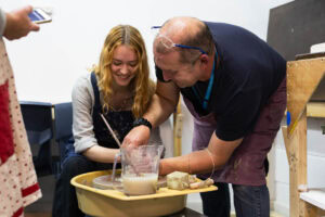 learner on pottery wheel