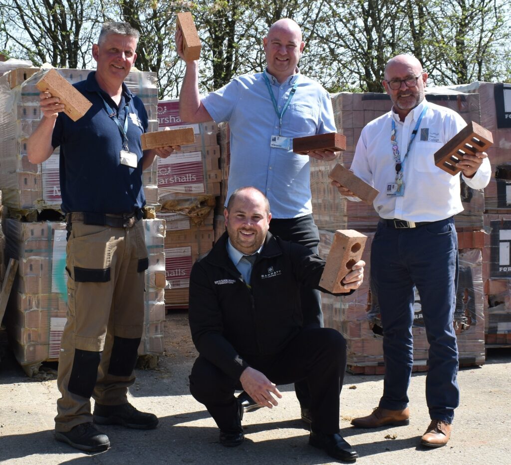 Lecturers with brick donation