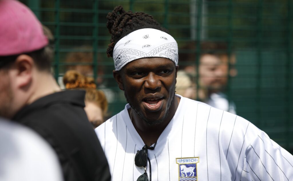 KSI in Ipswich Town shirt at Suffolk New College