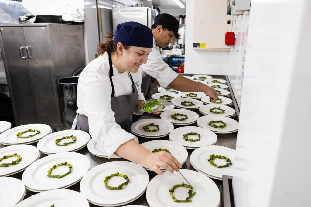 students preparing meals at college event