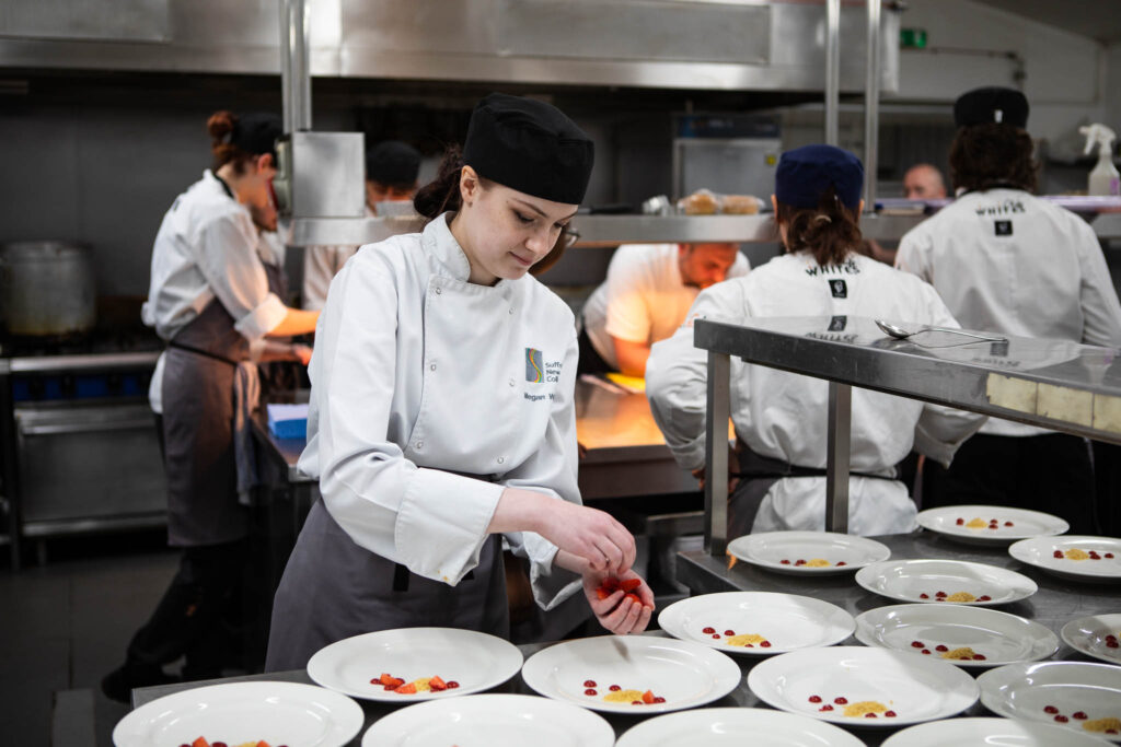 student preparing dessert for guests