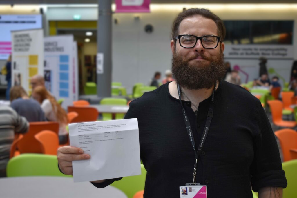 Man holding gcse results
