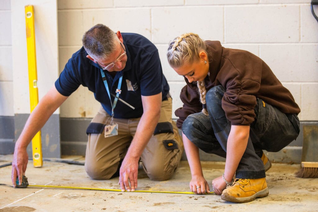 Bricklaying student being taught