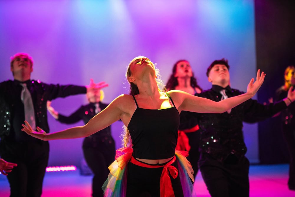 Learners dancing in a studio