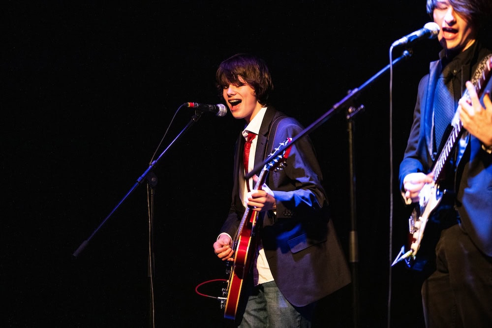 Music learners playing a show