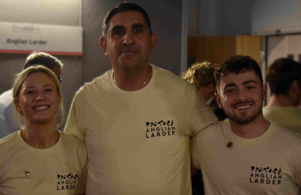 Skilled educators and students at Suffolk New College celebrating success and community spirit.