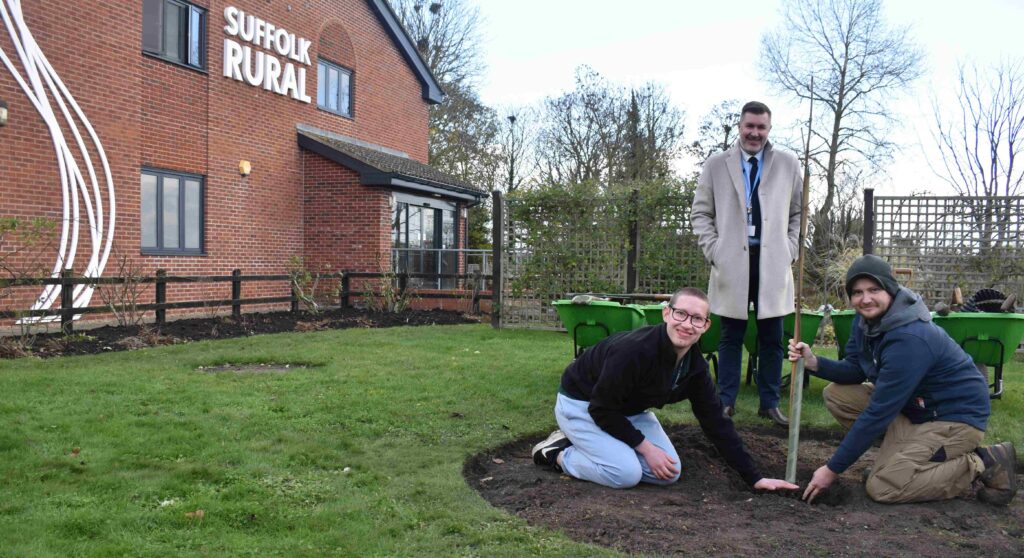 Group of students planting in a garden at Suffolk New College, demonstrating college environment and horticulture skills.