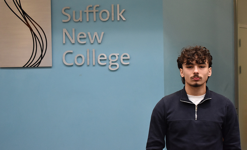 Young student at Suffolk New College campus, showing modern education facilities and welcoming atmosphere for prospective students.