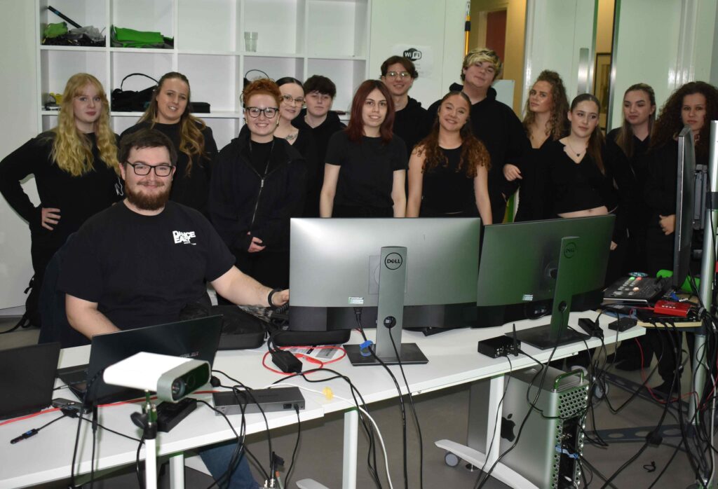 Diverse group of students learning digital media and computer skills at Suffolk New College.