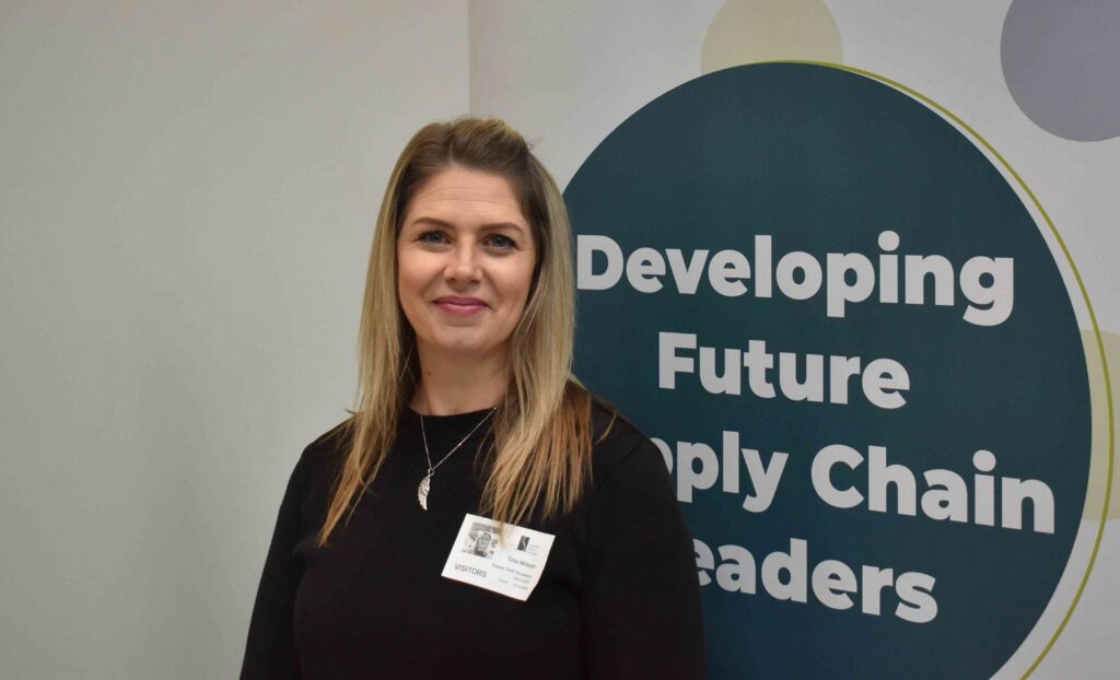 Suffolk New College staff member at Ipswich with "Developing Future Supply Chain Leaders" sign during national careers festival.