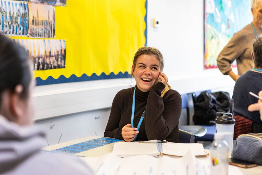 Learning environment at Suffolk New College with students studying and collaborating in a vibrant educational setting.