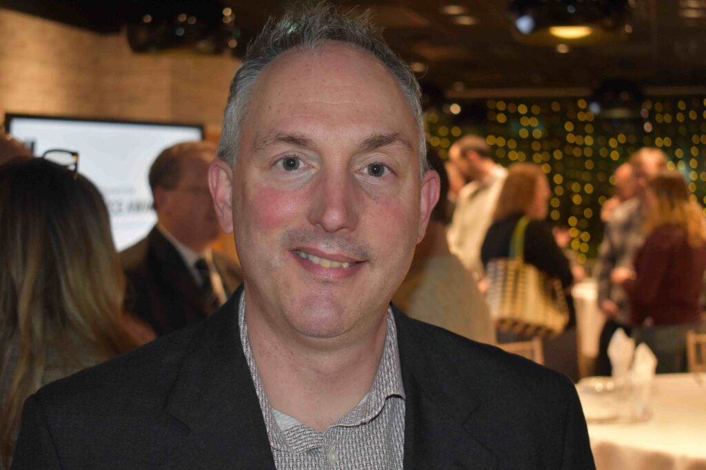 Civil engineer Gemma receiving the Suffolk New College Apprentice of the Year award at a celebratory event, highlighting success in vocational training and apprenticeships.