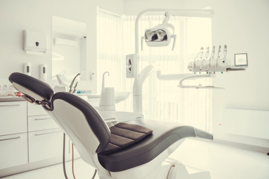 Modern dental clinic with dental chair and equipment, ideal for dental nursing training at Suffolk New College, supporting career development in dental healthcare.