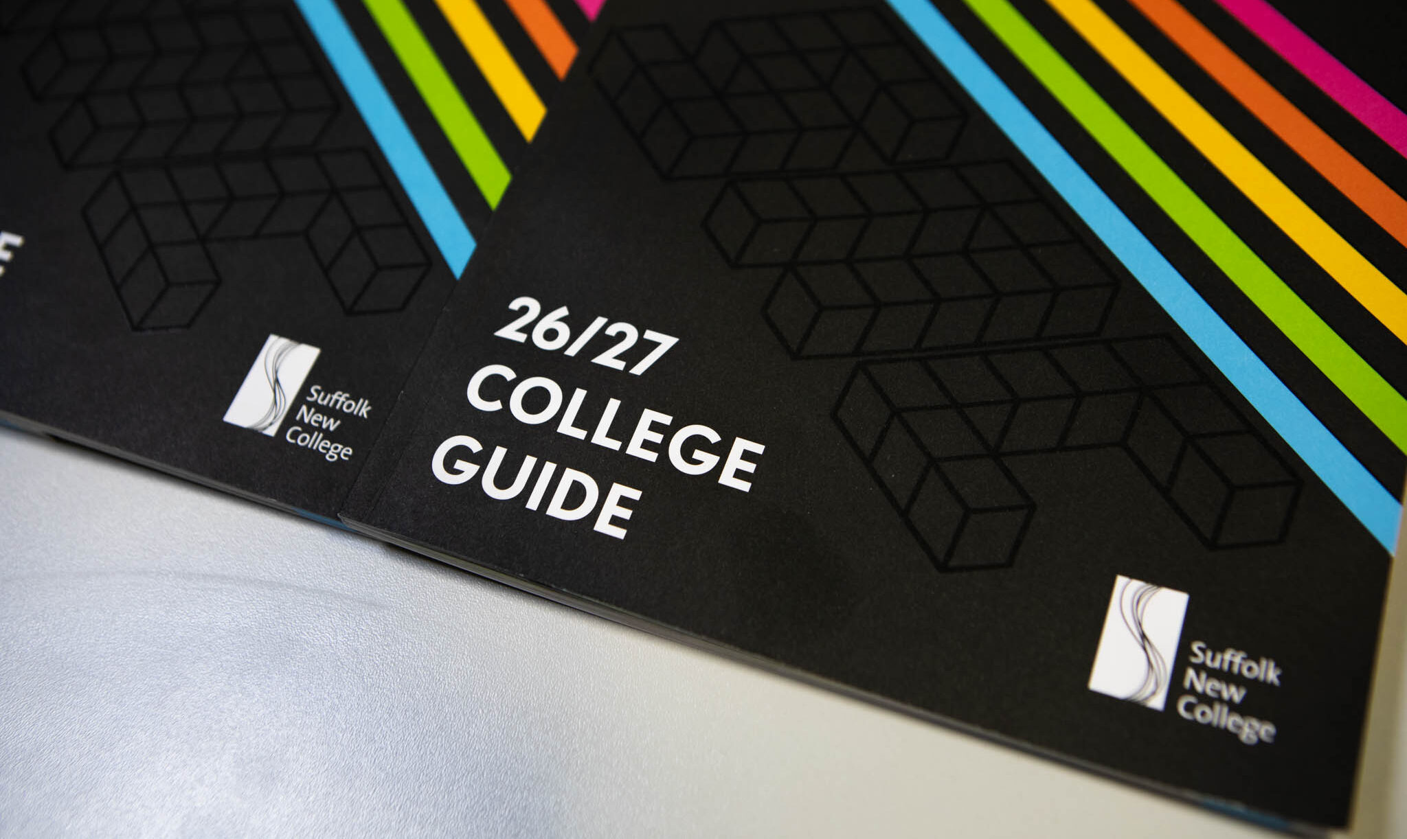 Suffolk New College College Guide 2026/27 with colourful rainbow design, promoting school engagement and student success.