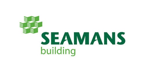 Exterior view of the Seamans Building at Suffolk New College, showcasing modern architecture and the college's educational facilities in a professional setting.