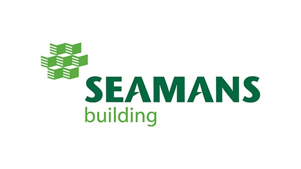 Exterior view of the Seamans Building at Suffolk New College, showcasing modern architecture and the college's educational facilities in a professional setting.